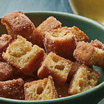 A bowl of toasty cider doughnut sroutons.
