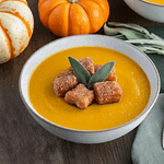 A bowl of squash with cider donut croutons