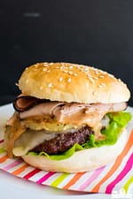 A big juicy Hawaiian Burger with ham and pineapple.