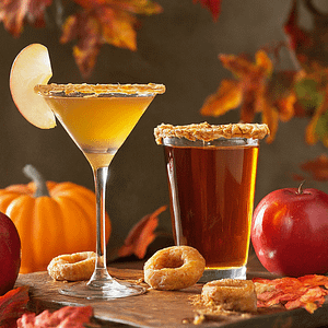 2 glasses of autumn drinks. An appleeini and a glass of cider.