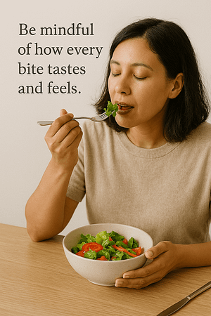 A woman eating with no distractions and savoring every bite.