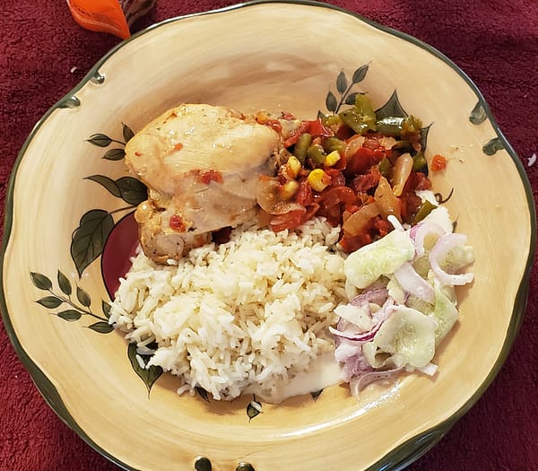 Adobo Chicken with cucumber salad and rice.